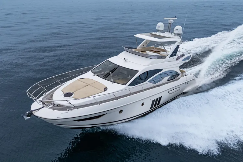  Yacht Photos Pics 2017 Azimut 54 Flybridge yacht cruising on open water.