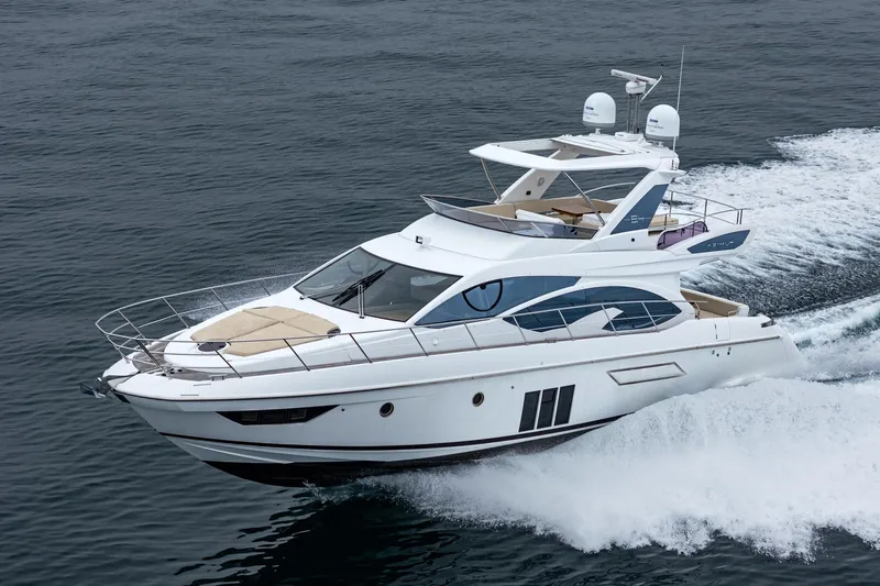  Yacht Photos Pics 2017 Azimut 54 Flybridge yacht cruising on open water.