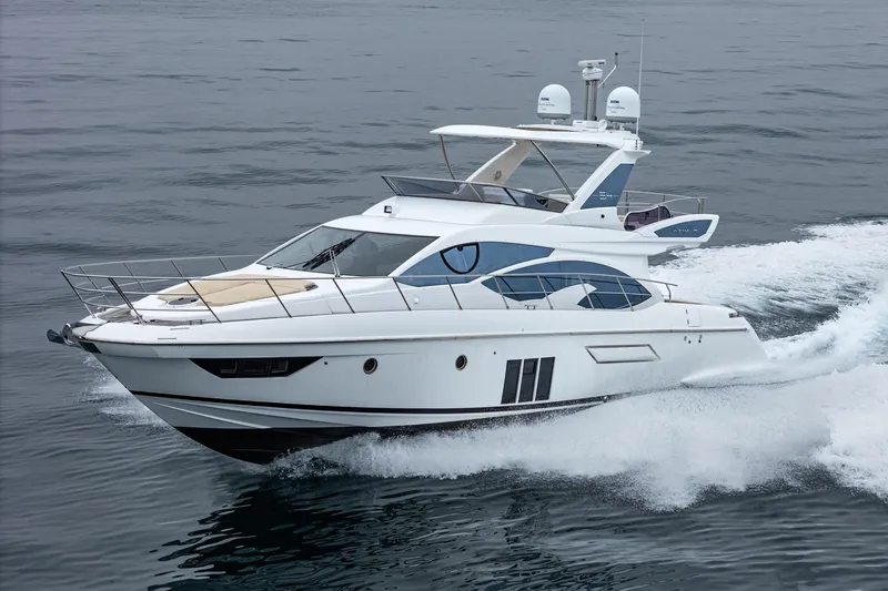  Yacht Photos Pics 2017 Azimut 54 Flybridge yacht cruising on open water.