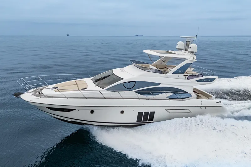 Yacht Photos Pics Luxury 2017 Azimut 54 Flybridge yacht cruising on open sea.