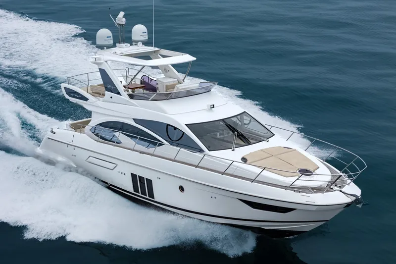  Yacht Photos Pics 2017 Azimut 54 Flybridge yacht cruising on open water.