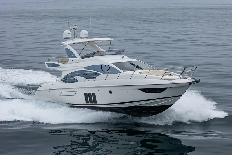  Yacht Photos Pics 2017 Azimut 54 Flybridge yacht cruising on open water.