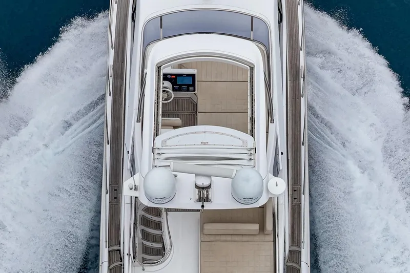  Yacht Photos Pics Azimut 54 Flybridge 2017 yacht cruising on open water, aerial view.