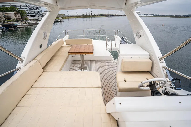  Yacht Photos Pics 2017 Azimut 54 Flybridge yacht with spacious seating and elegant design on calm waters.