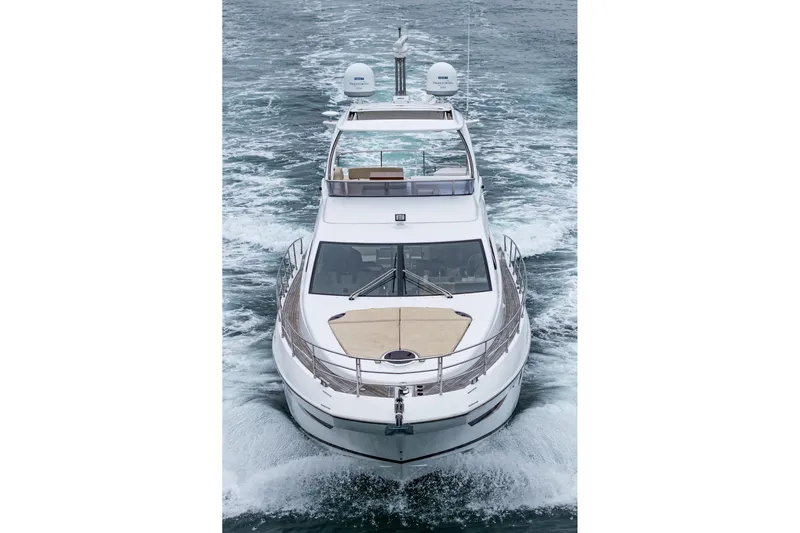  Yacht Photos Pics Azimut 54 Flybridge 2017 yacht cruising on open water, front view.