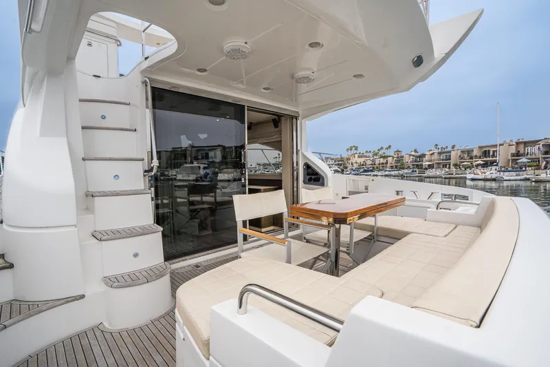  Yacht Photos Pics 2017 Azimut 54 Flybridge yacht with elegant outdoor seating and marina view.