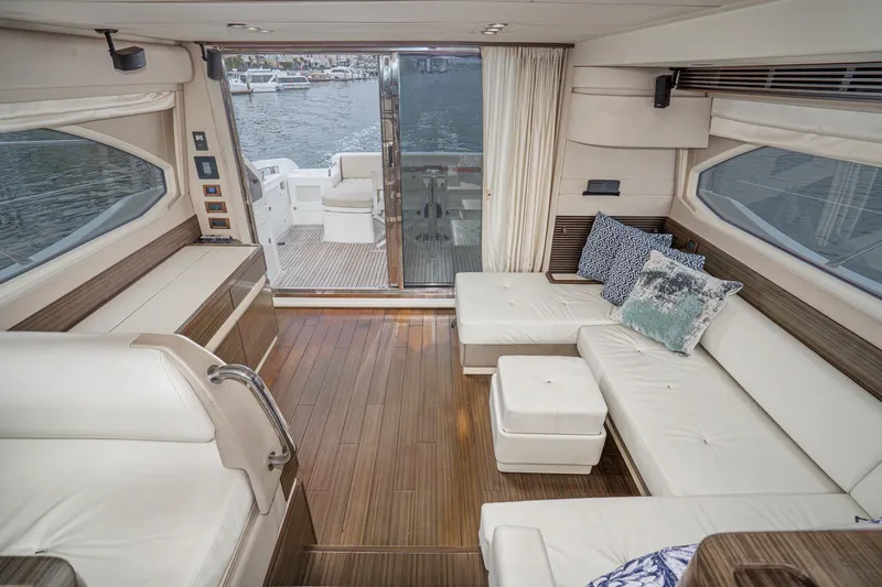  Yacht Photos Pics Luxurious interior of 2017 Azimut 54 Flybridge yacht with elegant seating and waterfront view.