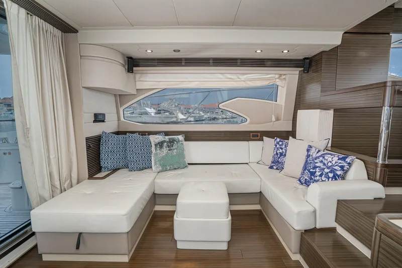  Yacht Photos Pics Luxurious interior of 2017 Azimut 54 Flybridge yacht with elegant seating and decorative cushions.