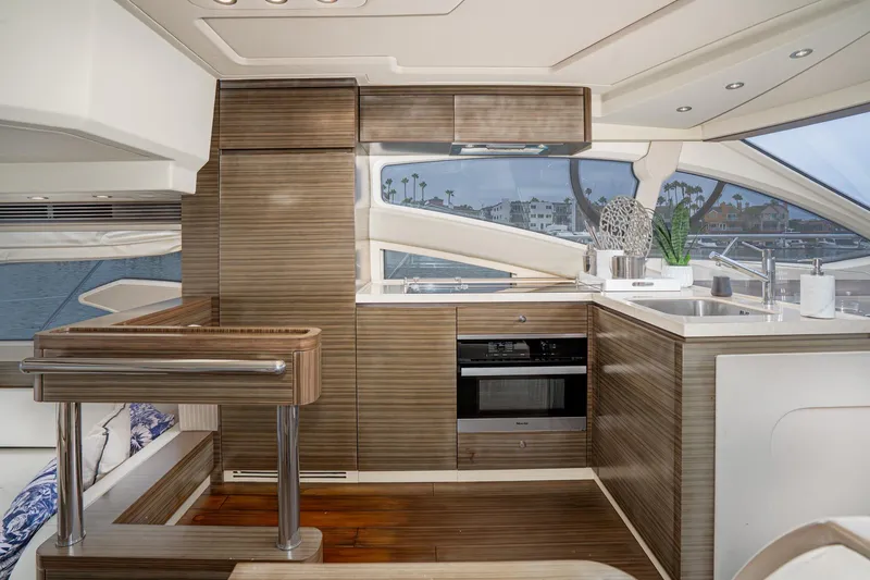  Yacht Photos Pics Luxurious interior of 2017 Azimut 54 Flybridge yacht with modern kitchen design.