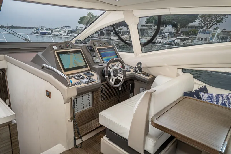  Yacht Photos Pics Luxurious 2017 Azimut 54 Flybridge yacht interior with modern navigation controls and plush seating.