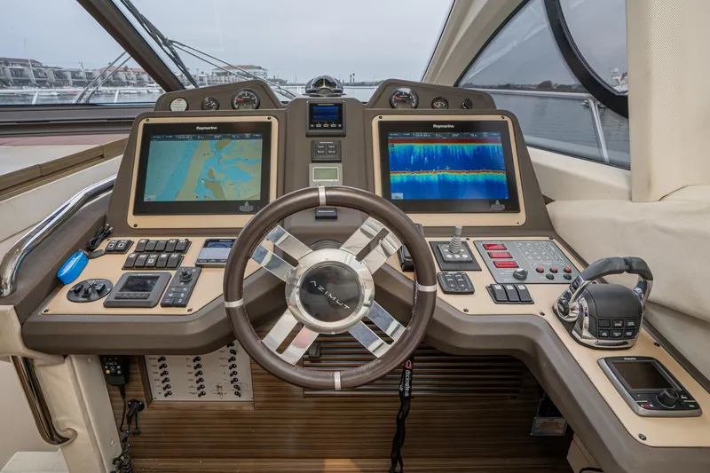  Yacht Photos Pics Cockpit of 2017 Azimut 54 Flybridge yacht with advanced navigation systems and controls.