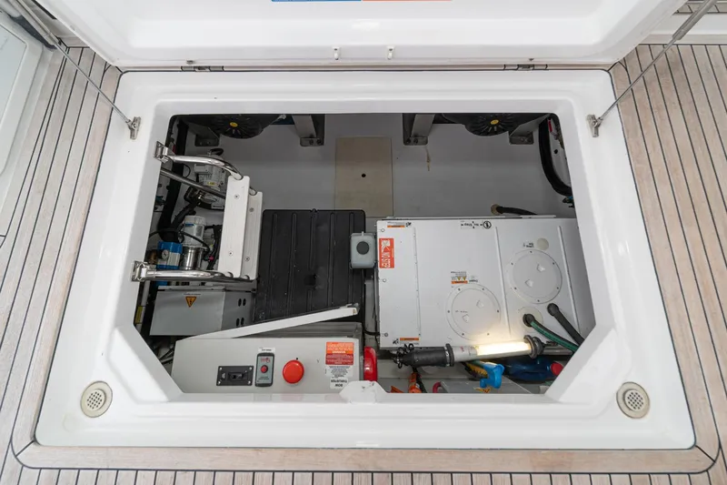  Yacht Photos Pics Engine compartment of 2017 Azimut 54 Flybridge yacht, showcasing mechanical components and systems.