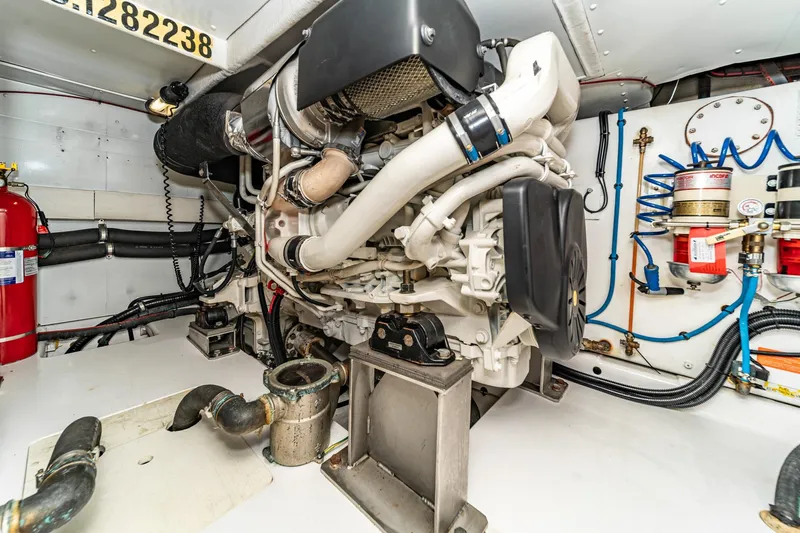  Yacht Photos Pics Engine room of 2017 Azimut 54 Flybridge yacht, showcasing detailed machinery and components.