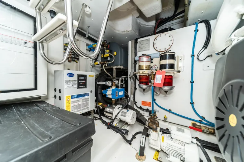  Yacht Photos Pics Engine room of 2017 Azimut 54 Flybridge yacht, showcasing mechanical and electrical systems.