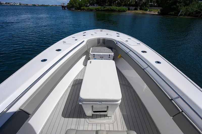 Bay Life Yacht Photos Pics 2024 Cape Horn 31T boat interior with seating and storage, docked on calm water.