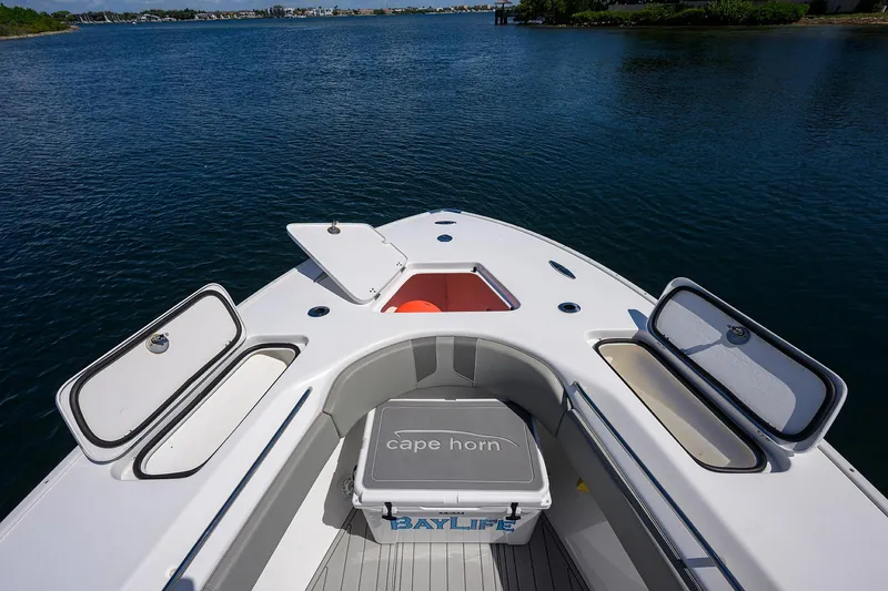 Bay Life Yacht Photos Pics 2024 Cape Horn 31T boat bow with open storage compartments on calm water.