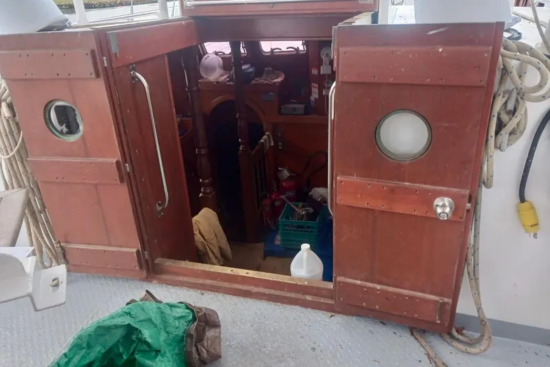 Cloud Chaser Yacht Photos Pics Wooden cabin entrance of a 1997 Hike Metal Products 67-foot steel ketch.