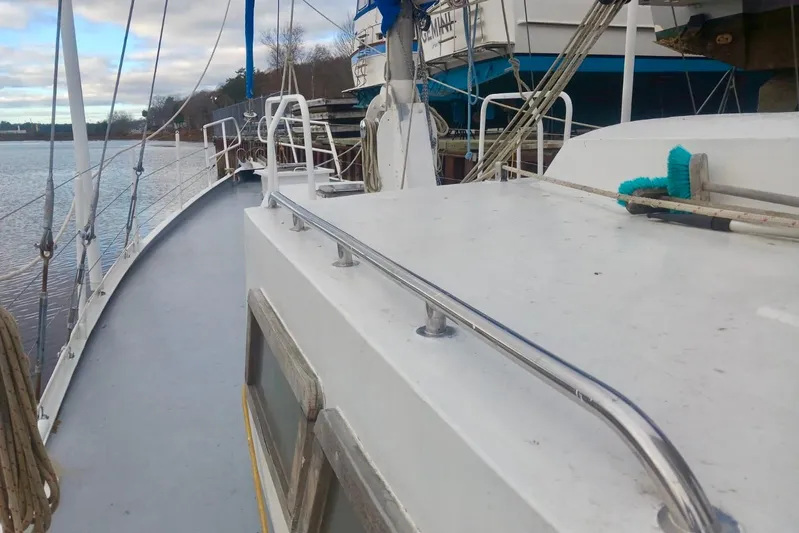Cloud Chaser Yacht Photos Pics 67-foot steel ketch by Hike Metal Products, 1997, docked with visible deck and railing.
