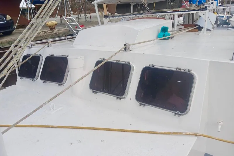 Cloud Chaser Yacht Photos Pics 1997 Hike Metal Products 67-foot steel ketch with multiple windows and deck ropes.