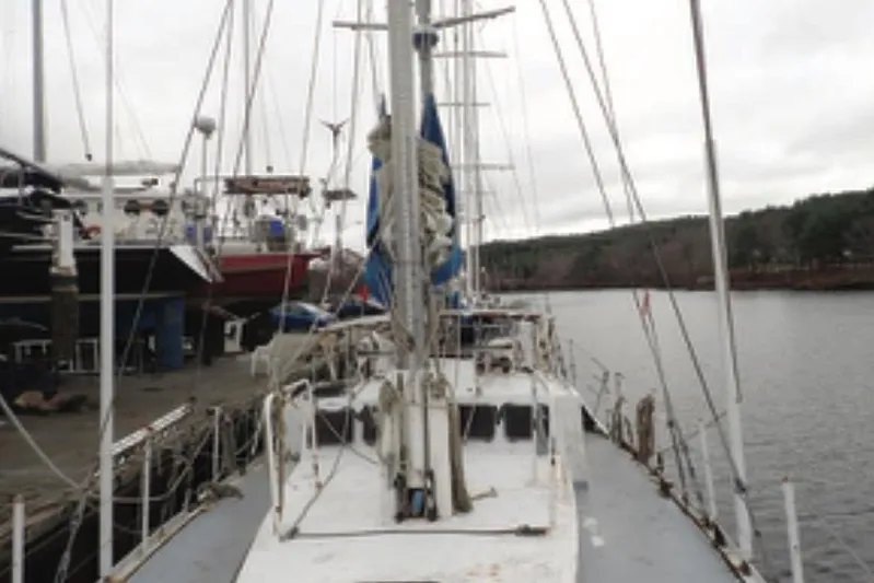 Cloud Chaser Yacht Photos Pics 1997 Hike Metal Products 67-foot steel ketch docked by the water.