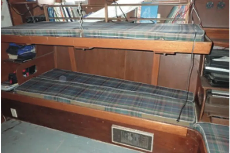 Cloud Chaser Yacht Photos Pics Interior of 1997 Hike Metal Products ketch with bunk beds and plaid cushions.