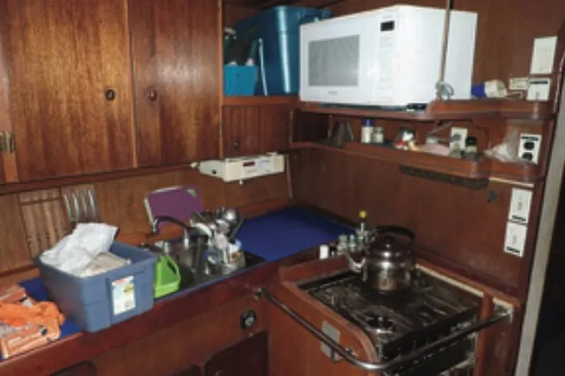 Cloud Chaser Yacht Photos Pics Galley kitchen in 1997 Hike Metal Products ketch with microwave and stove.