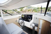 Modern helm of 2018 Steeler 52s yacht with navigation controls and panoramic view.