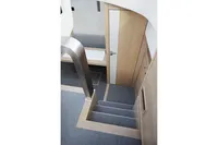Interior stairs of 2018 Steeler 52s yacht with modern design and wooden finish.