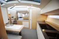 Modern interior of 2018 Steeler 52s yacht with sleek kitchen and dining area.