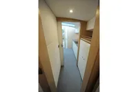 Interior hallway of 2018 Steeler 52s yacht, featuring modern design and cabinetry.