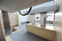 Modern interior of 2018 Steeler 52s yacht with sleek furnishings and light wood finishes.