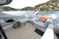 Luxurious 2018 Steeler 52s yacht deck with comfortable seating and scenic coastal view.