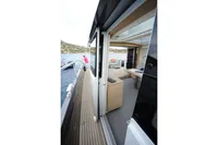 2018 Steeler 52s yacht interior with open deck and scenic water view.