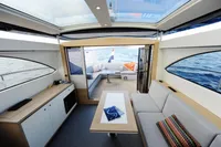 Luxurious interior of 2018 Steeler 52s yacht with modern seating and ocean view.