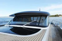 2018 Steeler 52s yacht on calm water, showcasing sleek design and spacious deck.