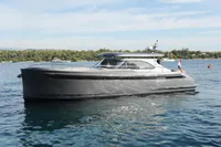 2018 Steeler 52s yacht on calm water, showcasing sleek design and modern features.
