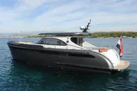 2018 Steeler 52s yacht on calm water, featuring sleek design and modern amenities.