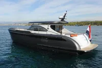 2018 Steeler 52s yacht on calm water, featuring sleek design and modern amenities.