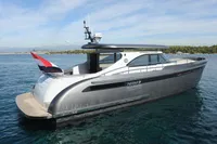 2018 Steeler 52s yacht on calm water, showcasing sleek design and modern features.