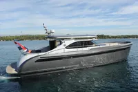 2018 Steeler 52s yacht cruising on a serene blue sea under a clear sky.