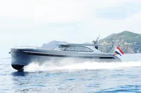 Steeler 52s 2018 yacht cruising on open water with scenic mountain backdrop.