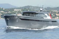 2018 Steeler 52s yacht cruising on a scenic coastal waterway.