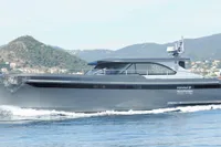 Steeler 52s 2018 yacht cruising on water with scenic mountain backdrop.