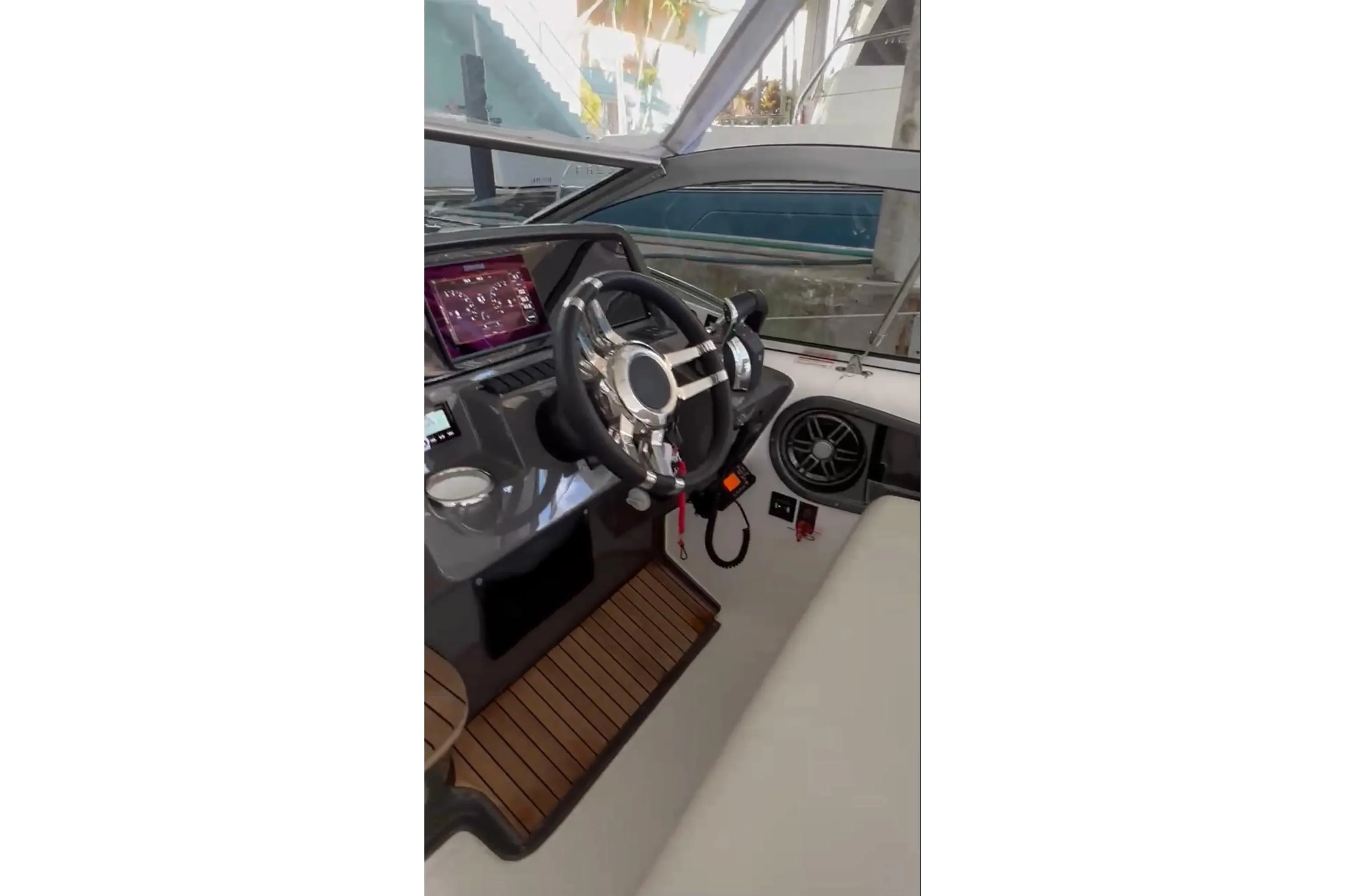 2023 Schaefer 303 Sport boat interior with modern steering and dashboard.