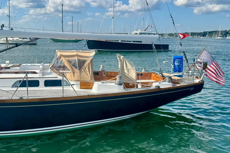 Fandango Yacht Photos Pics 1982 Hinckley Bermuda 40 MK III sailboat docked in a serene marina setting.