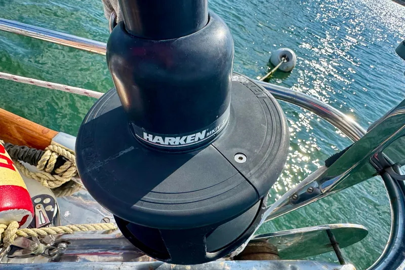 Fandango Yacht Photos Pics Harken winch on 1982 Hinckley Bermuda 40 MK III sailboat, with ocean background.