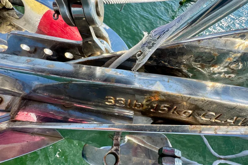 Fandango Yacht Photos Pics Close-up of a 1982 Hinckley Bermuda 40 MK III anchor, marked 33lb/15kg, above water.
