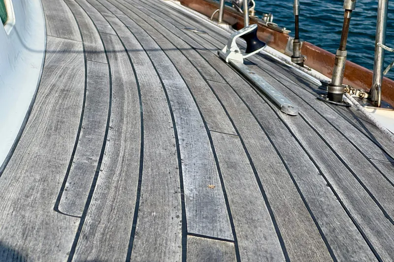 Fandango Yacht Photos Pics Teak deck of 1982 Hinckley Bermuda 40 MK III sailboat with metal fittings.