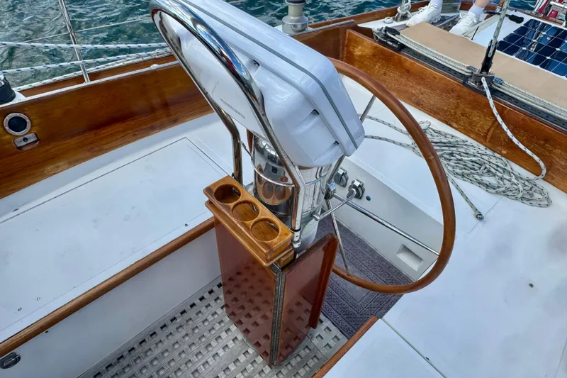 Fandango Yacht Photos Pics Cockpit of 1982 Hinckley Bermuda 40 MK III sailboat with wooden steering wheel.