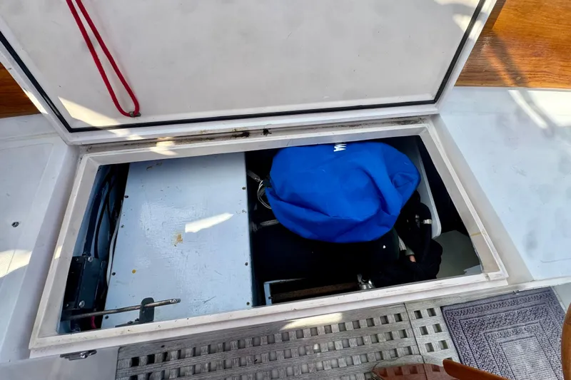 Fandango Yacht Photos Pics Open storage compartment on 1982 Hinckley Bermuda 40 MK III sailboat deck.